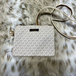 Michael Kors belt bag in a logo print.